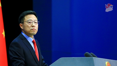 Chinese Ministry of Foreign Affairs spokesman Zhao Lijian stands at a lectern.