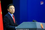 Chinese Ministry of Foreign Affairs spokesman Zhao Lijian stands at a lectern.