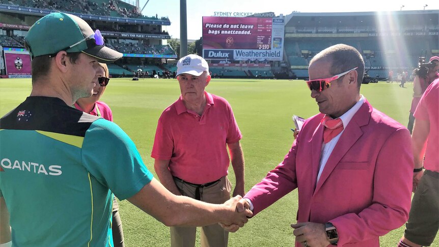 Steve Smith shakes hands with SCG ground announcer James Sherry after receiving the McGilvray Medal.