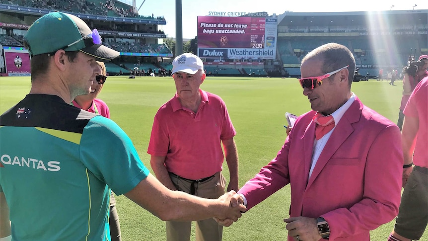 Steve Smith shakes hands with SCG ground announcer James Sherry after receiving the McGilvray Medal.