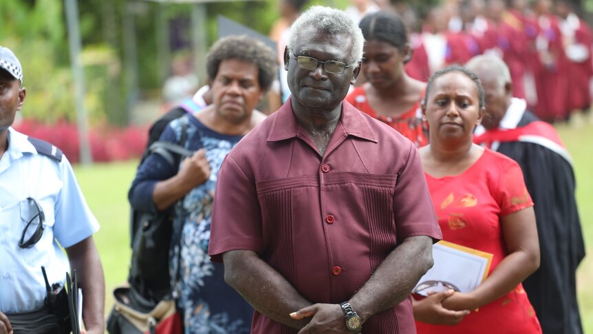 Manasseh Sogavare standing at an event outside.