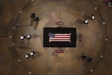 An aerial view shows George HW Bush's coffin lying in the middle of the Capitol Rotunda.