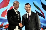 Qantas and Emirates CEOs shaking hands after first inking deal in 2012