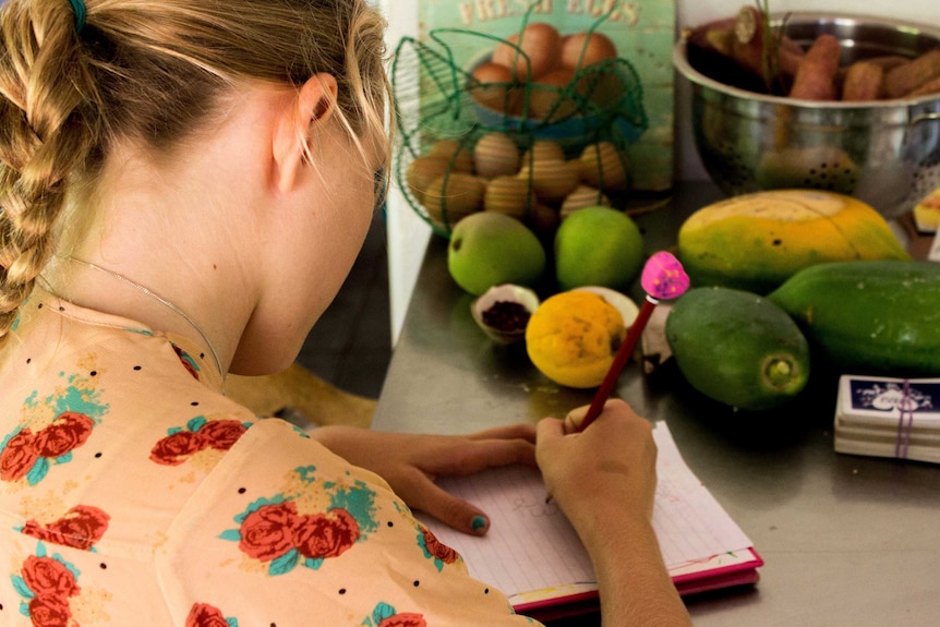 A student concentrates while studying during home schooling