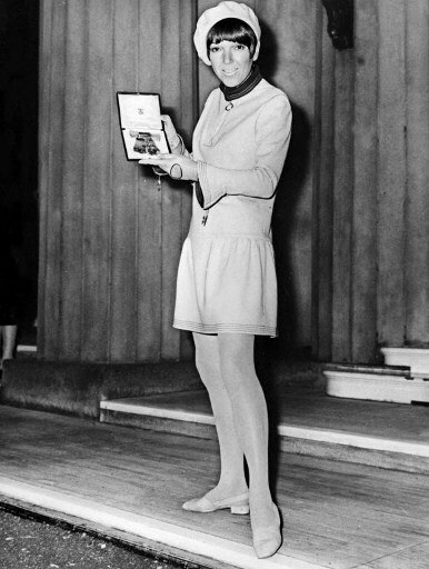 Mary Quant, designer in the 60s of the famous mini-skirt, poses with her Officer of the Order of the British Empire (OBE) medal 