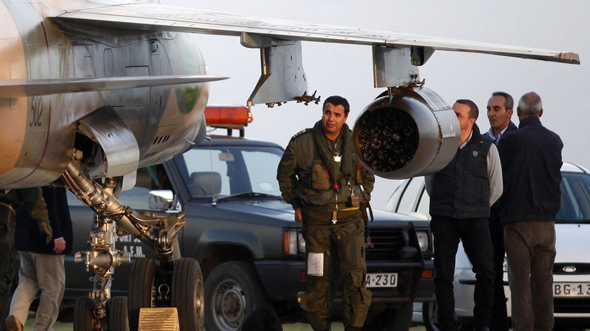 Two Libyan Air Force fighter pilots flew their jets to Malta where they told authorities they had been ordered to bomb protesters.