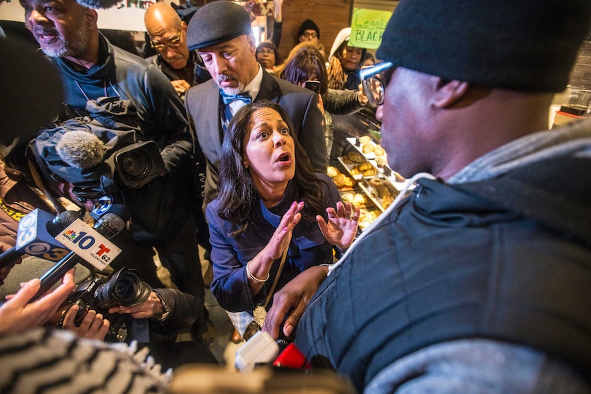 A Black Lives Matter activist confronts a Starbucks executive inside a store.