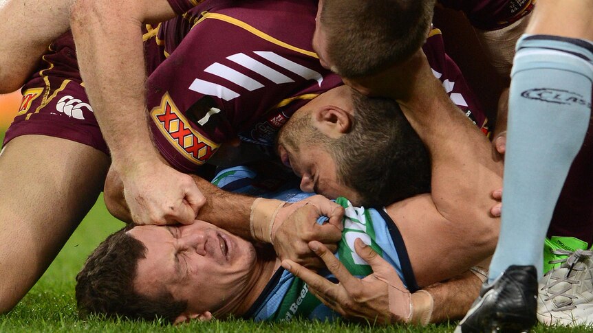 Qld player Brent Tate hits NSW player Greg Bird during State of Origin III