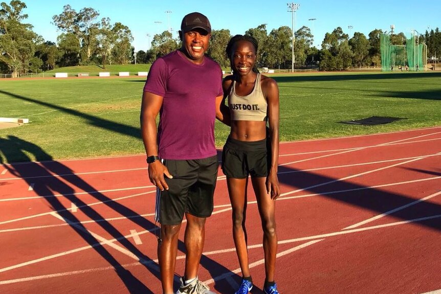 Bendere Oboya poses with her coach Greg Smith.