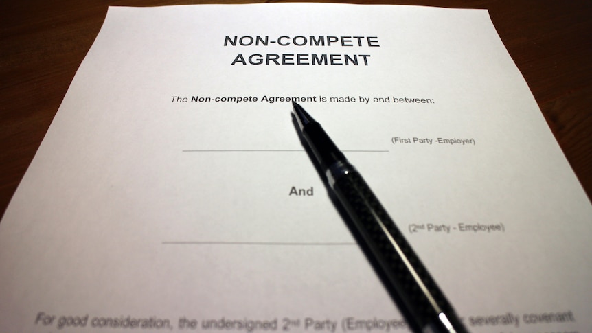 A pen rests on a piece of paper titled "non-compete agreement".