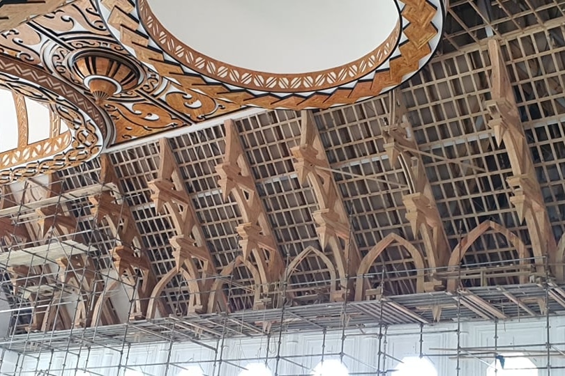 Wooden vaults covered in metal scaffolding while Lepea's church is being built.