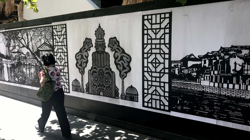 Some paper cut artworks by Zhou Bing and Philip Faulks as seen on a Melbourne street