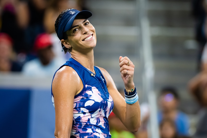 Ajla Tomljanović smiles and looks off to one side