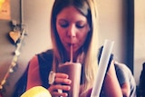 Jessica drinking a chocolate and kale smoothie in June 2014.