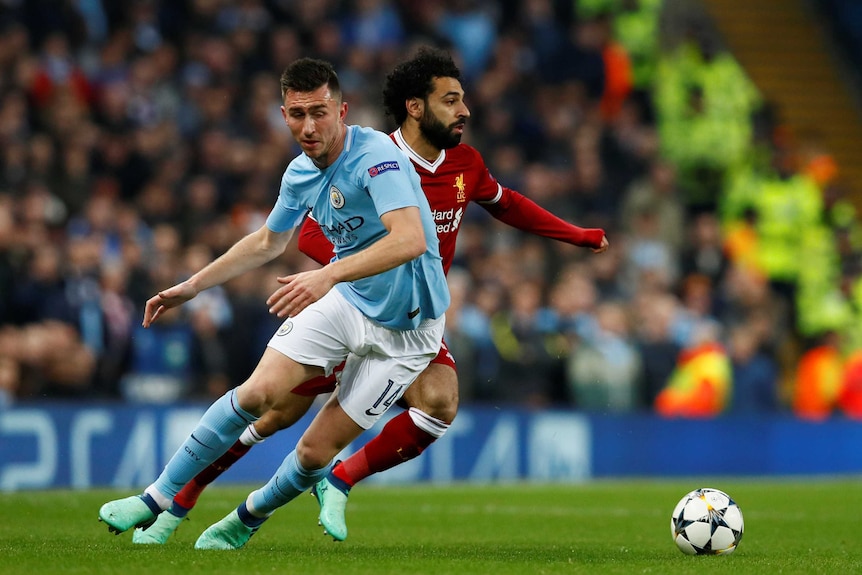 Liverpool's Mohamed Salah in action with Manchester City's Aymeric Laporte during their 2018 Champions League quarter-final