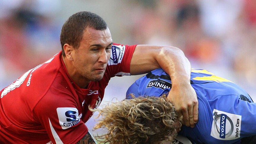 Defensive criticism ... Quade Cooper attempts to tackle the Force's Nick Cummins in round one