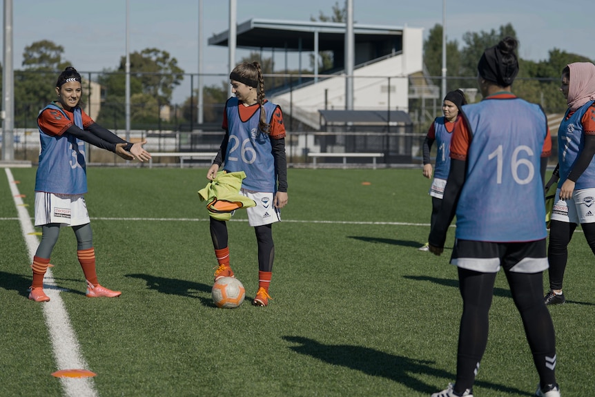 Afghan refugee women's team doing drills at training