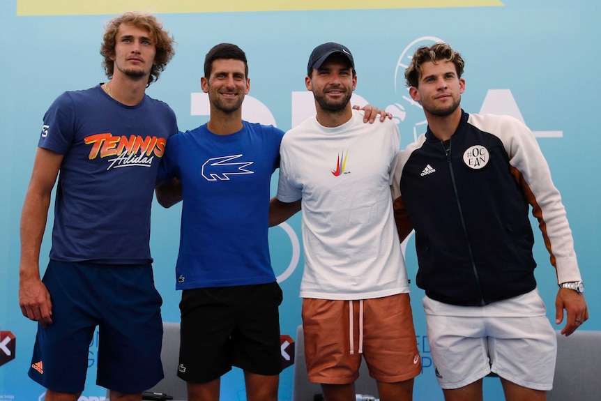 Novak Djokovic, Alexander Zverev, Grigor Dimitrov and Dominic Thiem stand arm in arm for a photo