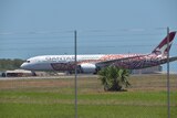 A photo of a Qantas plane flight