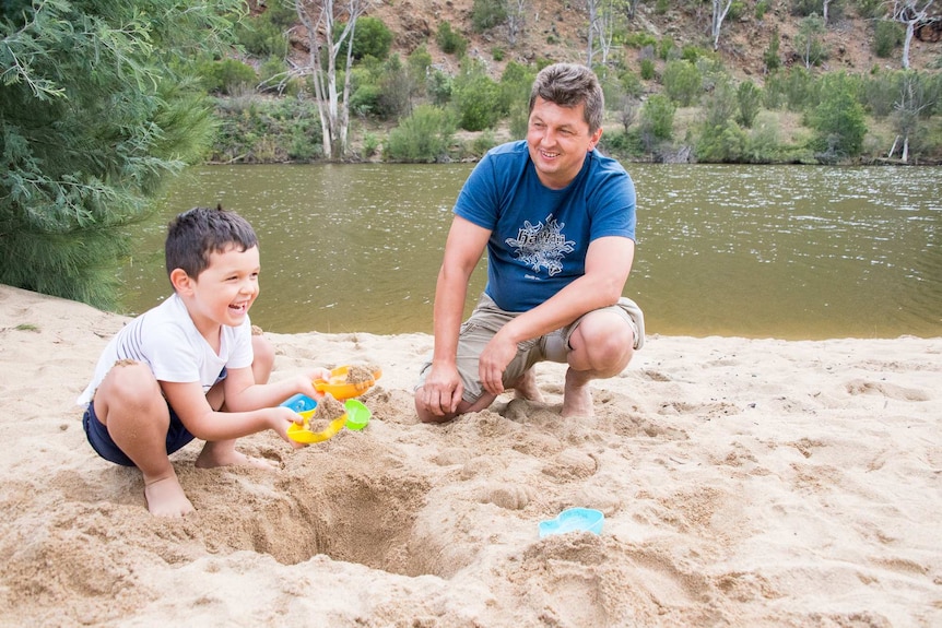 Five-year-old Jersey digging in the sand