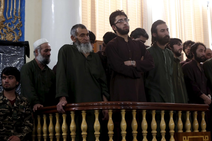 Defendants attend their trial at the Primary Court in Kabul