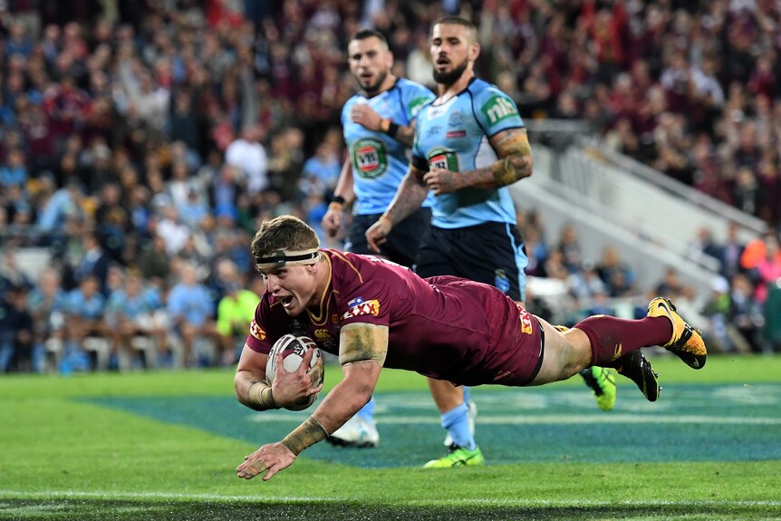 Jarrod Wallace of the Queensland Maroons scores a try during State of Origin Game 3.