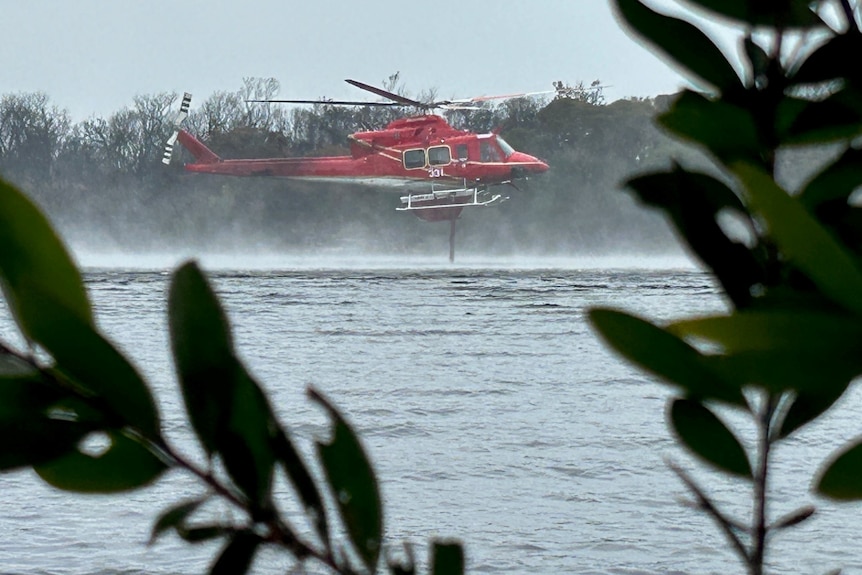 A RFS helicopter refueling water near Tyagarah 