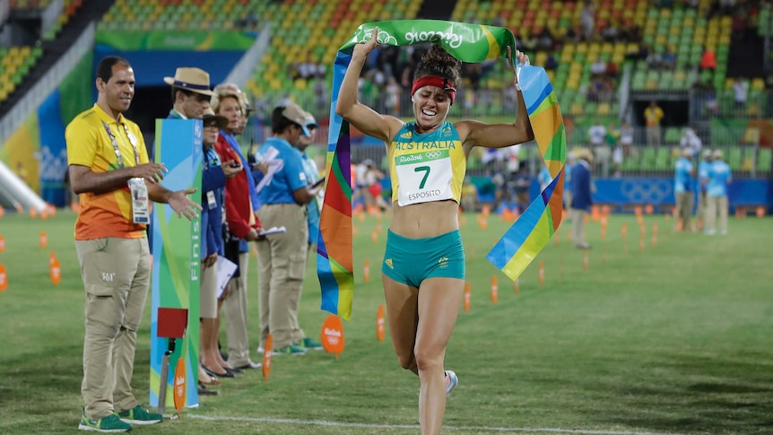 Chloe Esposito crosses the finish line to win the gold medal.