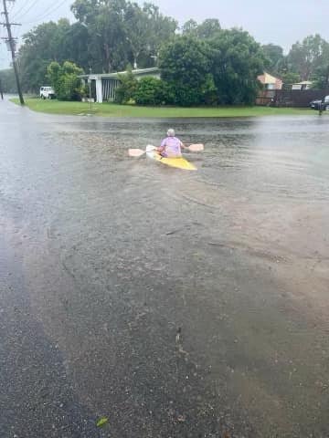 An elderly woman on a kayak.