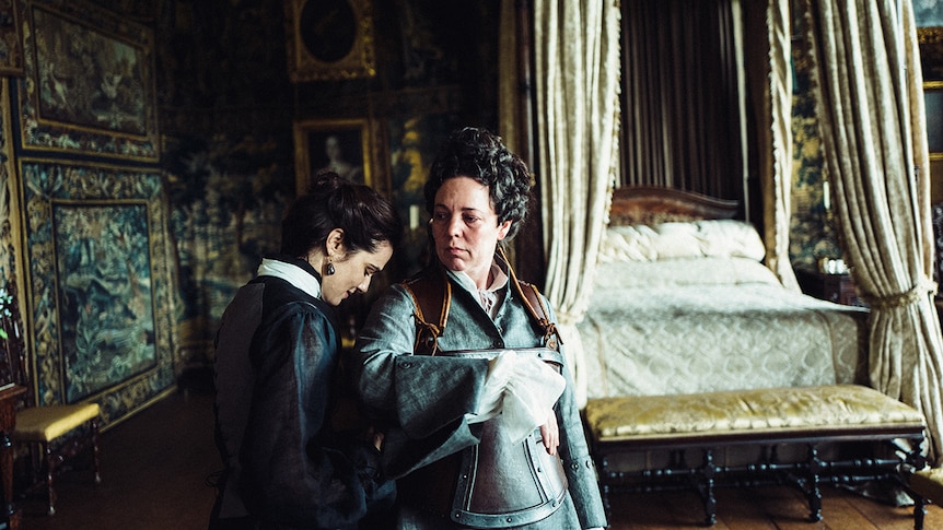 Rachel Weisz and Olivia Colman having an intimate moment in 2018 film The Favourite.