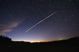 A streak of light across a night sky in the Kimberley.