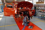 Mechanics work on an assembly line in a car factory of Chinese manufacturer Great Wall Motor Co in Europe. February 2012