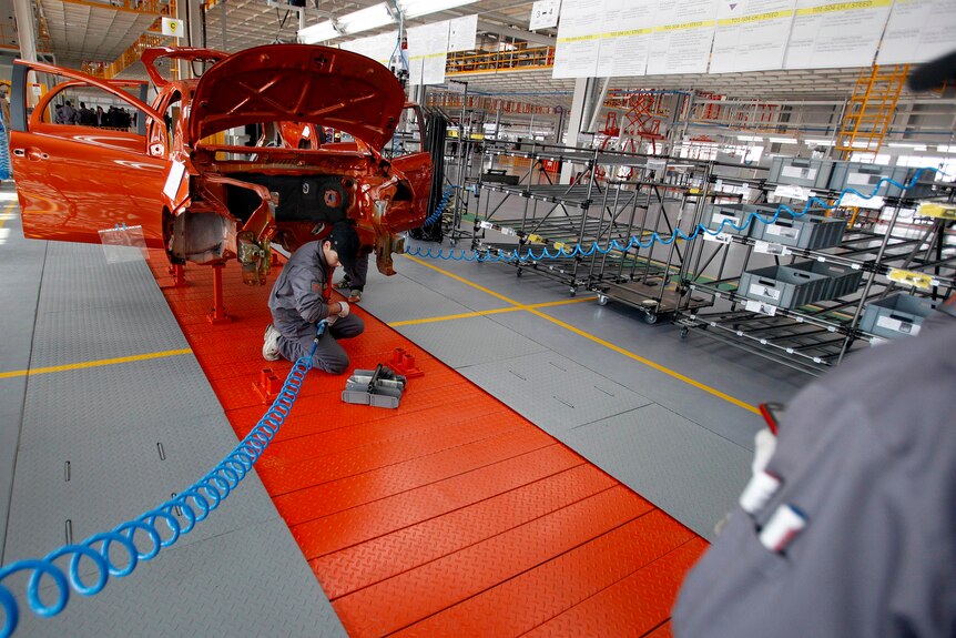 Mechanics works on an assembly line of Chinese car manufacturer Great Wall Motor Co.