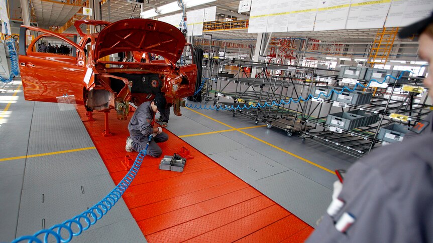 Mechanics works on an assembly line of Chinese car manufacturer Great Wall Motor Co.