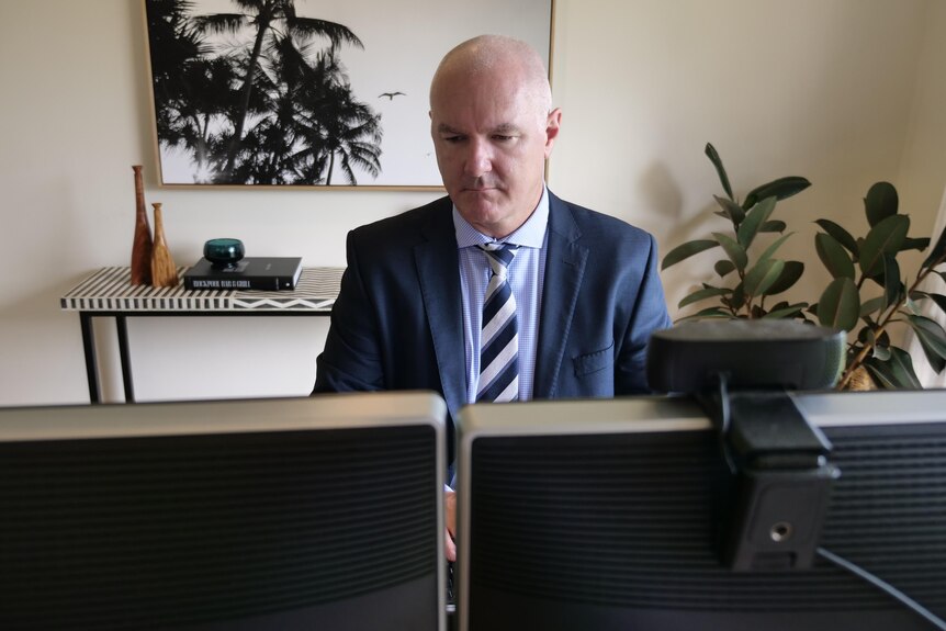 CoreLogic's Tim Lawless behind a computer.