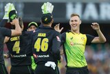 Australia's Billy Stanlake (R) celebrates his dismissal of New Zealand's Colin Munro in a T20i.