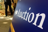 Auction sign outside listed property