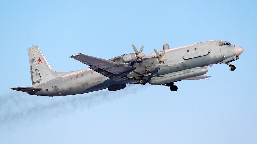 A Russian Air Force plane is flying in the sky.