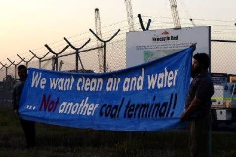 Activists from the Rising Tide group protest at a coal loader construction site on Newcastle's Kooragang Island.