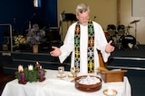Reverend David Curtis conducting a service at the St Thomas Anglican Church
