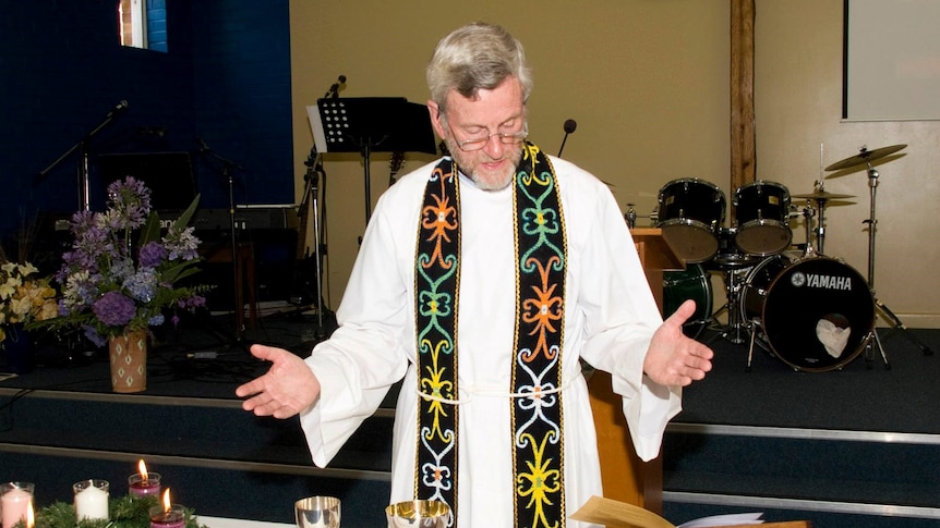 Reverend David Curtis conducting a service at the St Thomas Anglican Church