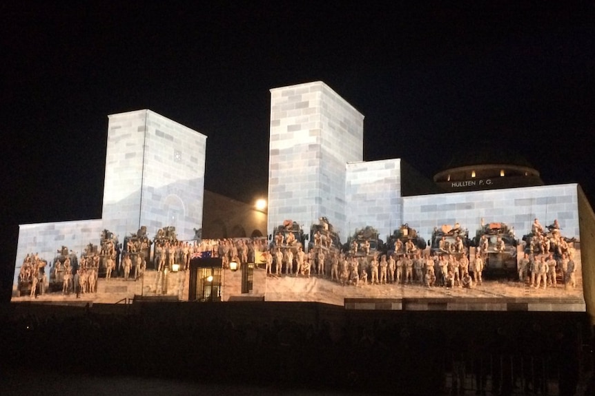 A projection of Australian troops on the War Memorial's facade.