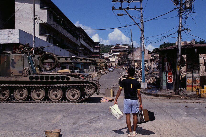 U.S troops patrol the streets of Panama in an armoured personnel carrier
