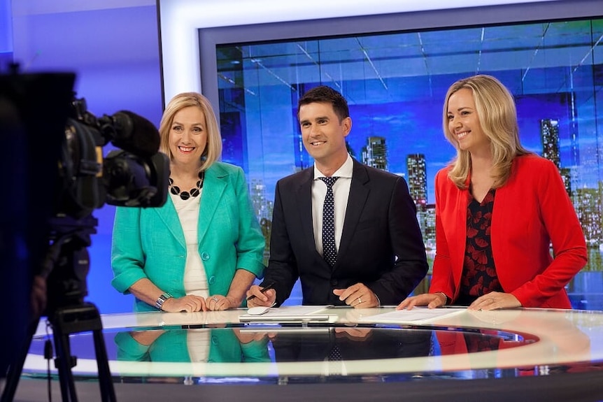 Jenny Woodward with Queensland newsreaders Matt Wordsworth and Jessica van Vonderen at the TV studio in Brisbane.