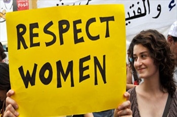 A woman holds a placard honouring 'respect' for women