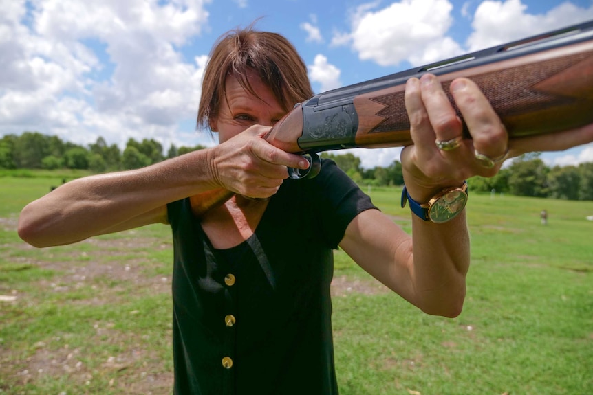 Lil Brandt stares down the barrel of a gun ready to shoot.