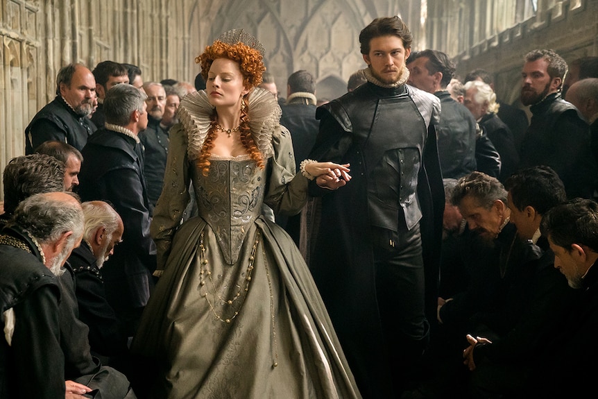 Colour still of Margot Robbie and Joe Alwyn in 2018 film Mary Queen of Scots.