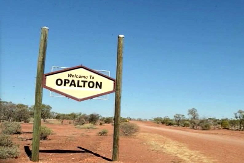 A sign reads "Welcome to Opalton" in central west Queensland.