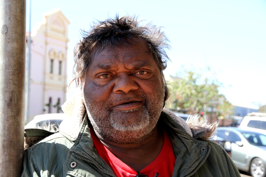 Kirk Sullivan standing on the street looking at camera