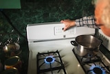 Mac Abrotsky uses his gas stove to heat his 5th floor apartment.